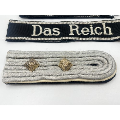 2309 - A collection of reproduction German military shoulder boards and cuff titles