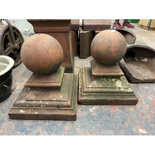 937 - Three terracotta garden items, one Victorian chimney pot and one pair of ball pillar caps