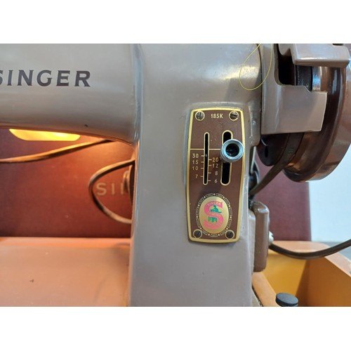 836 - A Singer 185K electric sewing machine with foot pedal, boxed attachments, mains adaptor and instruct... 