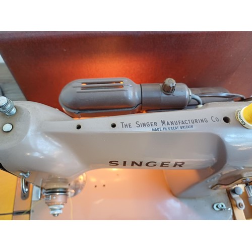 836 - A Singer 185K electric sewing machine with foot pedal, boxed attachments, mains adaptor and instruct... 