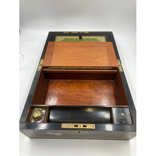 651 - A 19th century burr walnut and marquetry inlaid writing slope with leather insert and inkwell