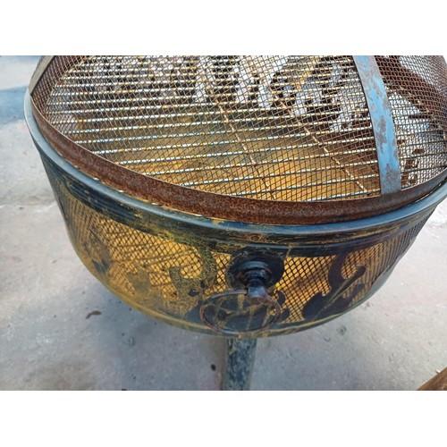 960 - Two items, one cast iron fire grate with griddle and one tri- footed garden fire pit