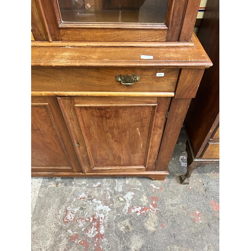 16 - A Victorian satinwood bookcase with two upper glazed doors and two lower cupboard doors - approx. 22... 