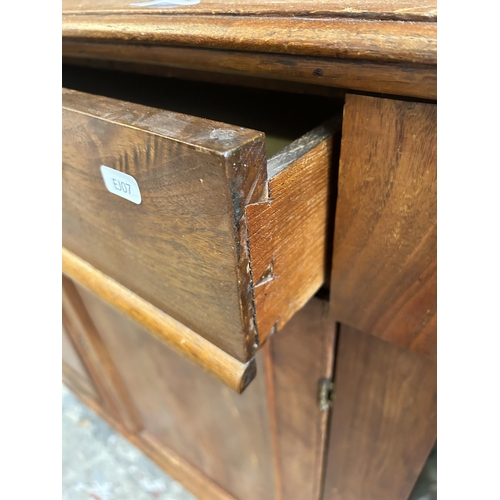 16 - A Victorian satinwood bookcase with two upper glazed doors and two lower cupboard doors - approx. 22... 