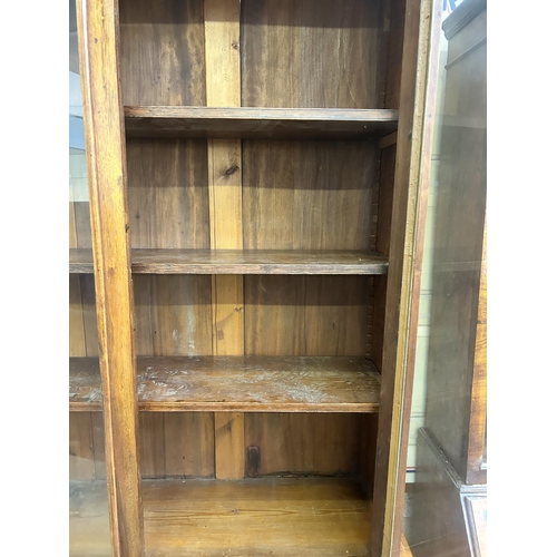 16 - A Victorian satinwood bookcase with two upper glazed doors and two lower cupboard doors - approx. 22... 