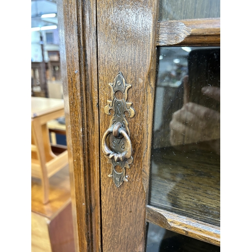 191 - An oak free standing corner cabinet