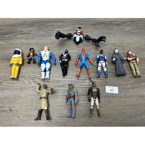 594 - A collection of vintage action figurines to include Star Wars, Spider-Man etc.