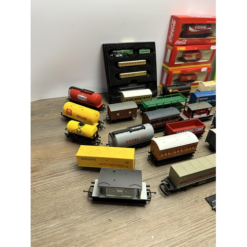 600 - A collection of model railway accessories to include boxed Hornby Coca-Cola tank wagon, Atlas Editio... 