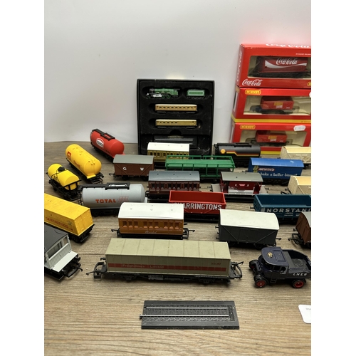 600 - A collection of model railway accessories to include boxed Hornby Coca-Cola tank wagon, Atlas Editio... 