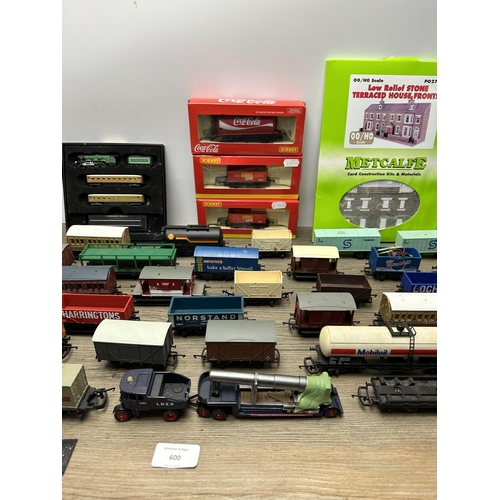 600 - A collection of model railway accessories to include boxed Hornby Coca-Cola tank wagon, Atlas Editio... 