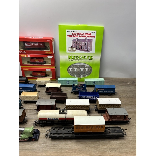 600 - A collection of model railway accessories to include boxed Hornby Coca-Cola tank wagon, Atlas Editio... 