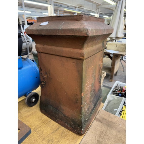 1153 - A terracotta chimney pot planter