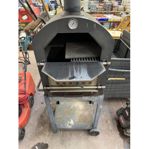 1182A - A metal outdoor pizza oven with temperature gauge