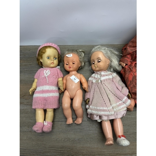 591 - Four vintage dolls