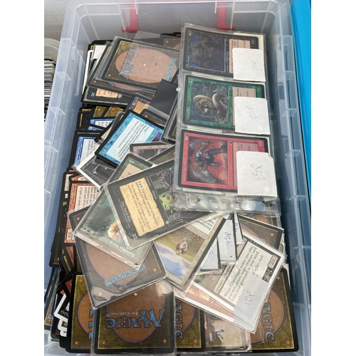 584 - Three boxes containing a large collection of Magic The Gathering trading cards