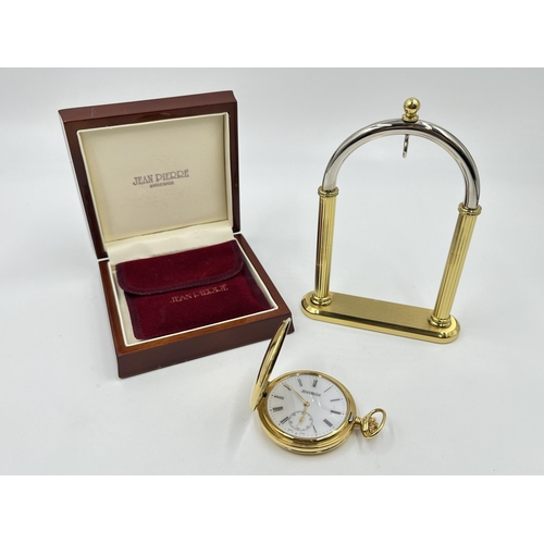 A boxed Jean Pierre 9ct gold cased full hunter hand wind pocket watch with a chromium plated and gilt metal stand - approx. gross weight with movement 73.61g