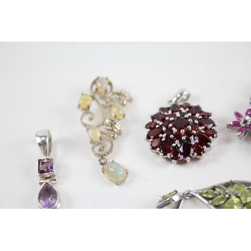 2064 - Ten silver gemstone set pendants to include ruby, tanzanite etc. - approx. gross weight 39g