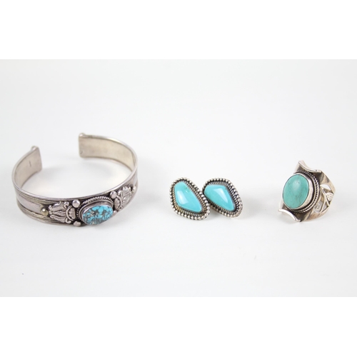 2069 - Three pieces of silver gemstone set jewellery, one pair of E. M. Linkin Navajo earrings, one bangle ... 