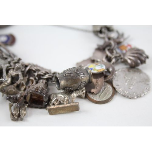 2072 - A silver charm bracelet with enamel souvenir charms - approx. gross weight 126g