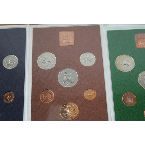 2207A - Four The Coinage of Great Britain and Northern Ireland proof coin sets, 1974, 1975, 1976 and 1977