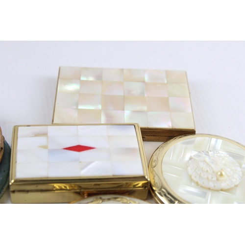 635 - Twelve vintage powder compacts