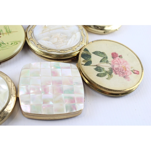 635 - Twelve vintage powder compacts