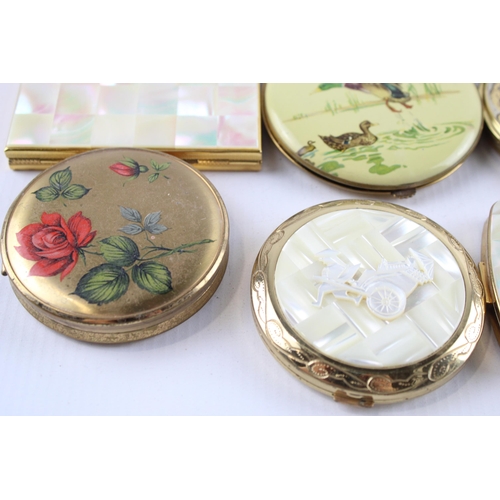 635 - Twelve vintage powder compacts