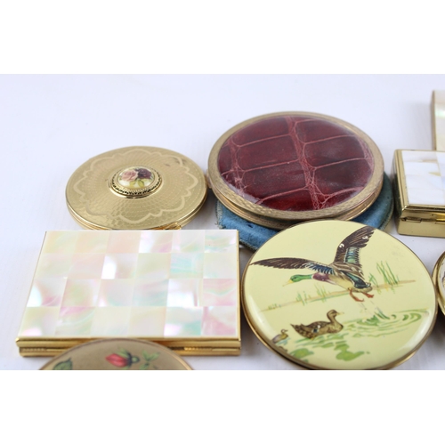 635 - Twelve vintage powder compacts