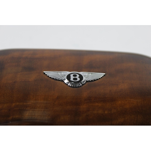 641 - A Bentley walnut glasses case with black leather interior