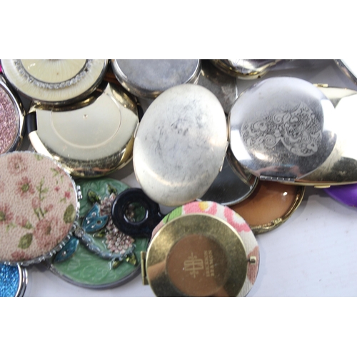 657 - A large collection of assorted compact mirrors