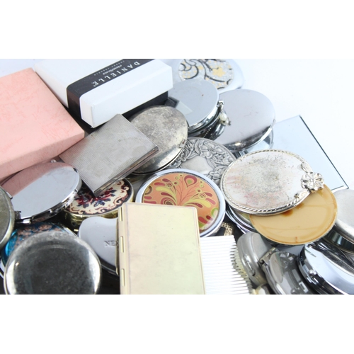 657 - A large collection of assorted compact mirrors