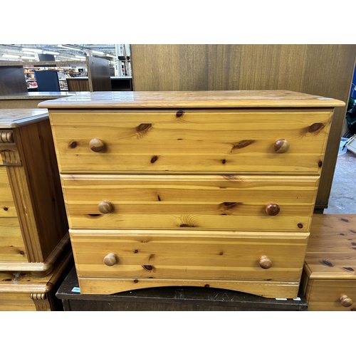 100 - A pine effect chest of drawers - approx. 69cm high x 81cm wide x 44cm deep