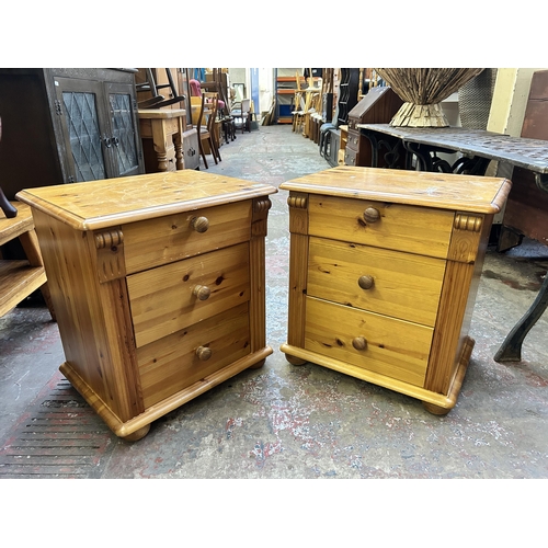 103 - A pair of pine bedside chests of drawers - approx. 61cm high x 56cm wide x 42cm deep