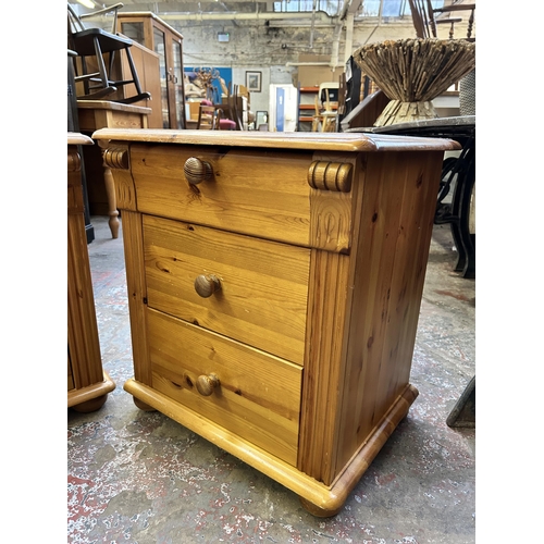 103 - A pair of pine bedside chests of drawers - approx. 61cm high x 56cm wide x 42cm deep