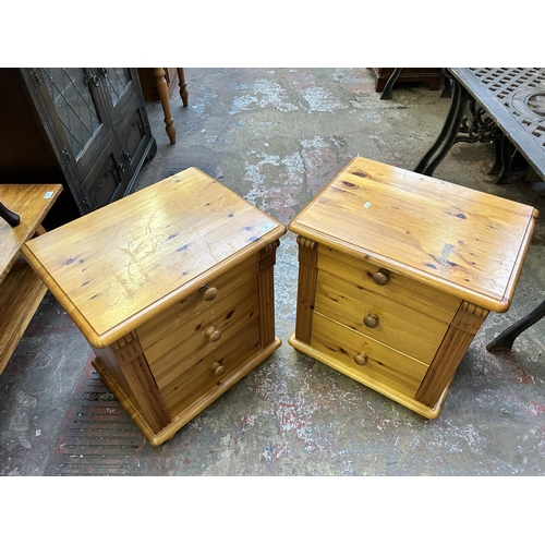 103 - A pair of pine bedside chests of drawers - approx. 61cm high x 56cm wide x 42cm deep