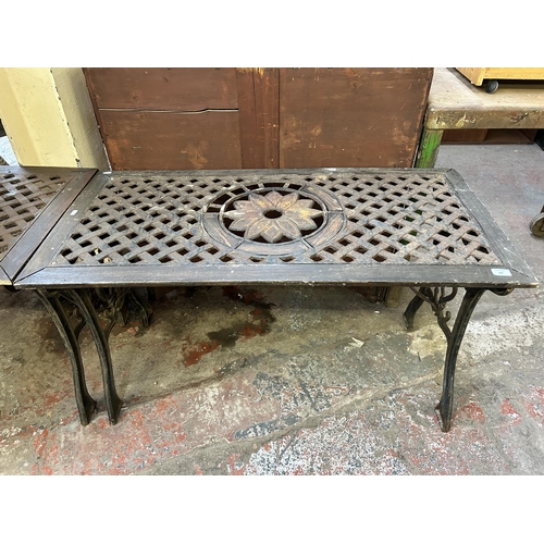 104 - A modern cast iron and wood garden table - approx. 66cm high x 57cm wide x 116cm long