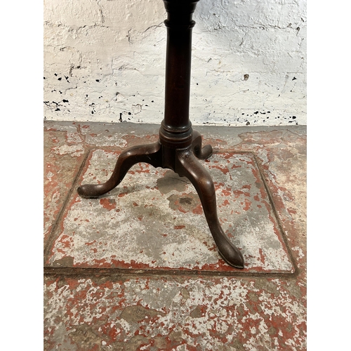 106 - A George III mahogany circular tilt top tripod occasional table - approx. 115cm high when tilted x 8... 