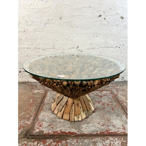 107 - A contemporary driftwood and glass top circular coffee table - approx. 42cm high x 75cm in diameter