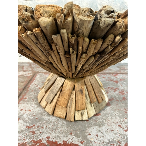 107 - A contemporary driftwood and glass top circular coffee table - approx. 42cm high x 75cm in diameter