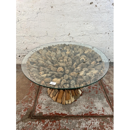 107 - A contemporary driftwood and glass top circular coffee table - approx. 42cm high x 75cm in diameter