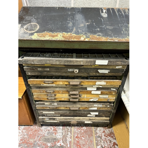 11 - A mid 20th century black painted steel printer's cabinet containing nineteen wooden printer's trays ... 