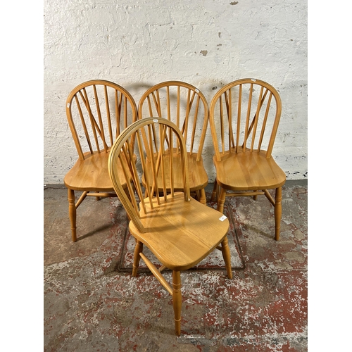 117 - Four beech Windsor dining chairs