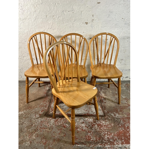 117 - Four beech Windsor dining chairs