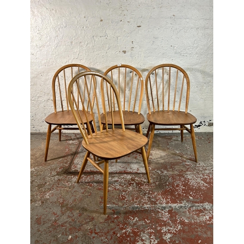 123 - Four Ercol blonde elm and beech Windsor dining chairs