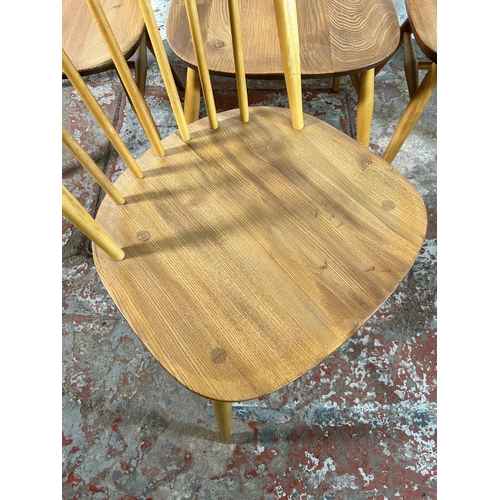 123 - Four Ercol blonde elm and beech Windsor dining chairs