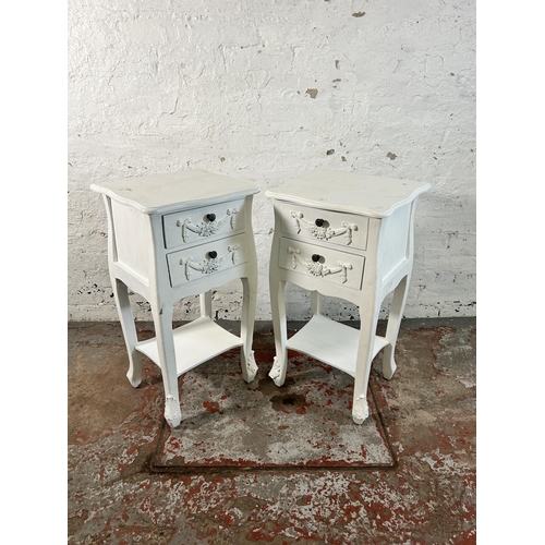 125 - A pair of French style white painted two drawer bedside tables - approx. 76cm high x 39cm wide x 35c... 