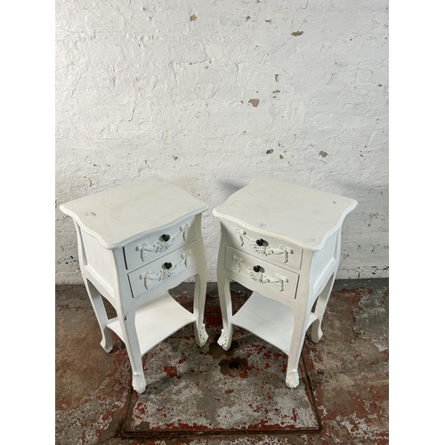 125 - A pair of French style white painted two drawer bedside tables - approx. 76cm high x 39cm wide x 35c... 