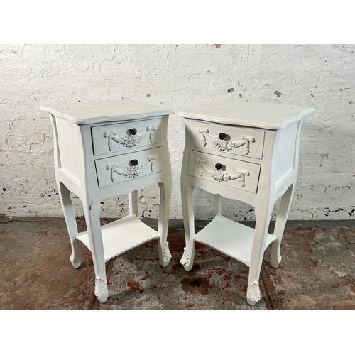 125 - A pair of French style white painted two drawer bedside tables - approx. 76cm high x 39cm wide x 35c... 