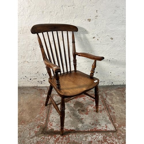 128 - A Victorian stained elm and beech farmhouse armchair