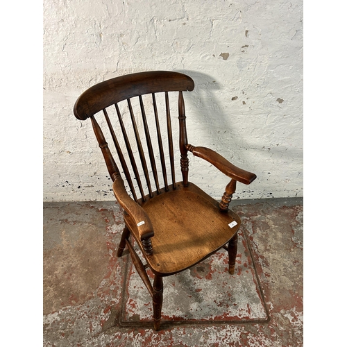 128 - A Victorian stained elm and beech farmhouse armchair